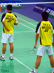 Badminton Doubles Players serving: Koo Kien Keat / Tan Boon Heong